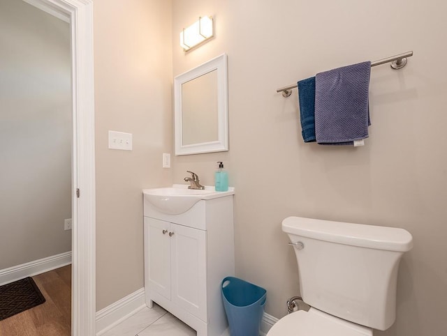 bathroom with toilet and vanity