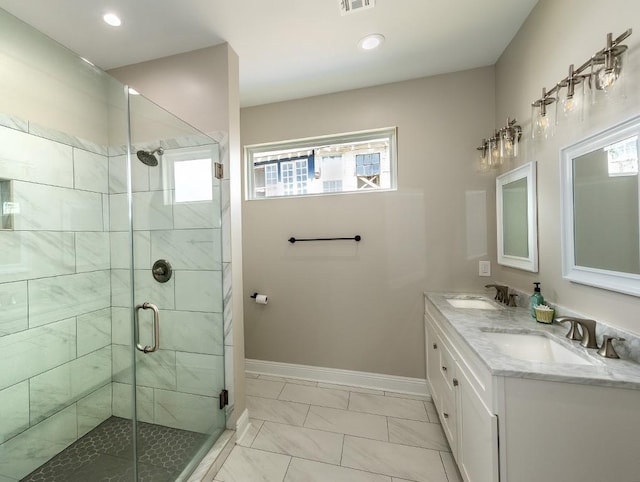 bathroom with an enclosed shower and vanity