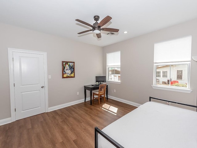 bedroom featuring ceiling fan and dark wood-type flooring