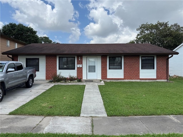 756 Mystic Ave, Gretna, LA 70056 - ranch-style house featuring a front yard, a shingled roof, and brick siding