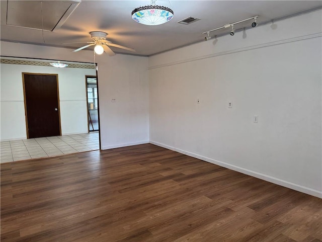 756 Mystic Ave, Gretna, LA 70056 - empty room with wood finished floors, attic access, baseboards, visible vents, and a ceiling fan