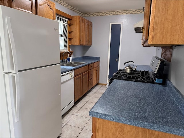 756 Mystic Ave, Gretna, LA 70056 - kitchen with a sink, light tile patterned floors, ventilation hood, white appliances, and dark countertops