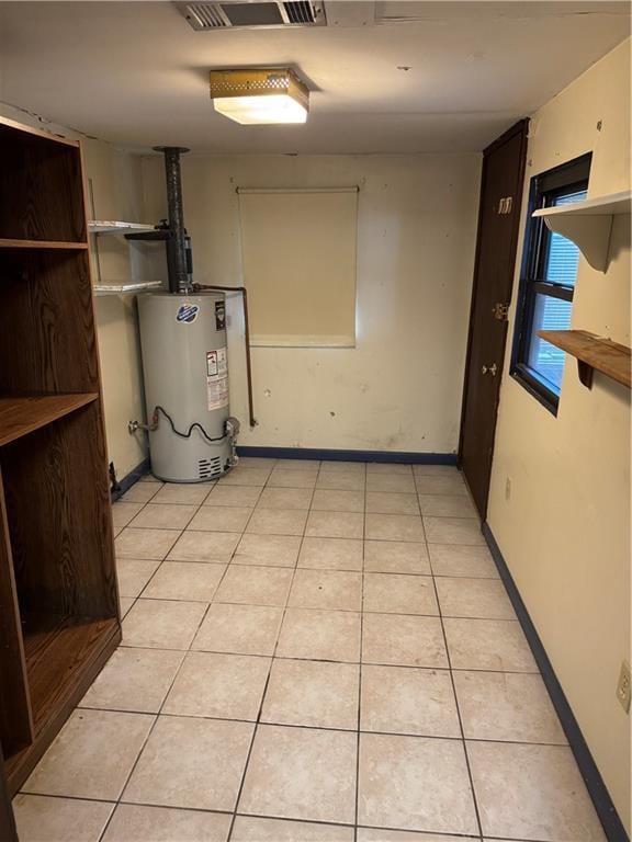 utility room featuring gas water heater