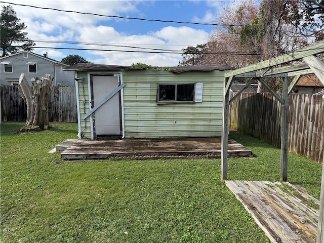 view of outbuilding featuring a yard