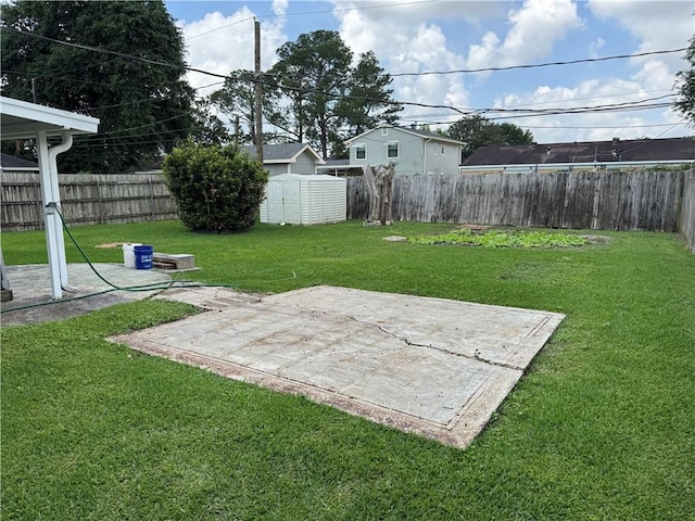 756 Mystic Ave, Gretna, LA 70056 - view of yard with an outdoor structure, a patio, a storage unit, and a fenced backyard
