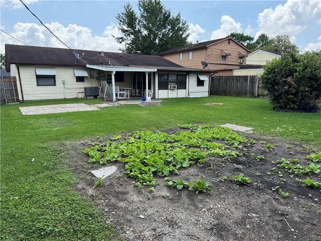 756 Mystic Ave, Gretna, LA 70056 - back of property with a lawn, a patio area, a fenced backyard, and central AC unit