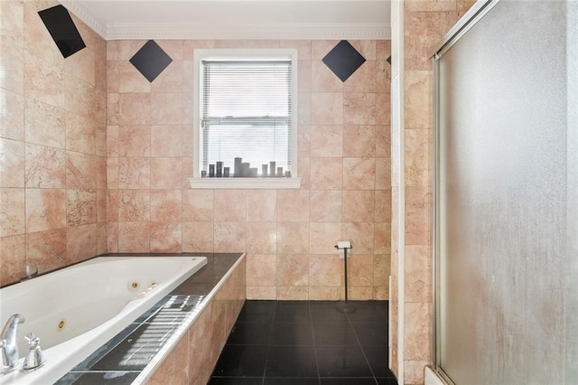 bathroom featuring crown molding, tile patterned flooring, tile walls, and independent shower and bath