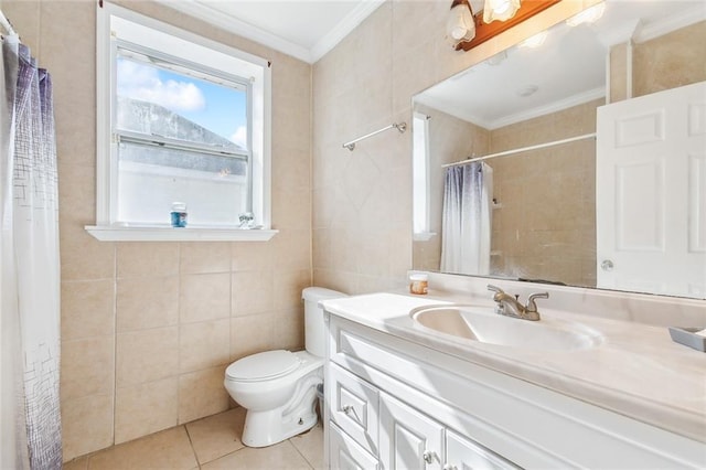 bathroom with toilet, vanity, tile patterned flooring, tile walls, and crown molding