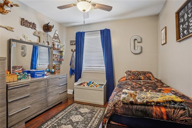 bedroom featuring ceiling fan and dark hardwood / wood-style flooring