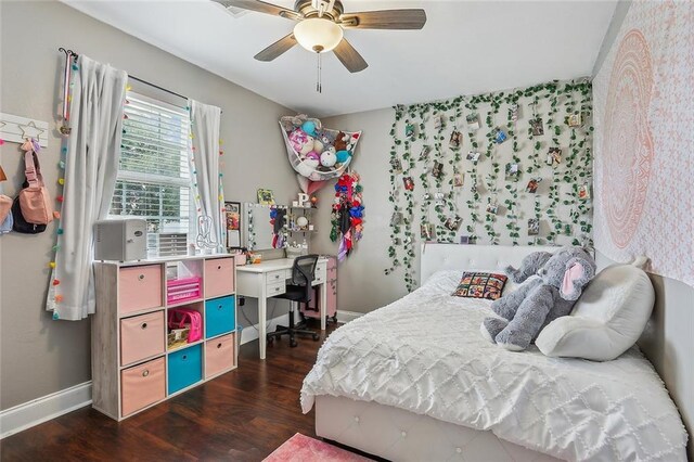 bedroom with ceiling fan and dark hardwood / wood-style flooring