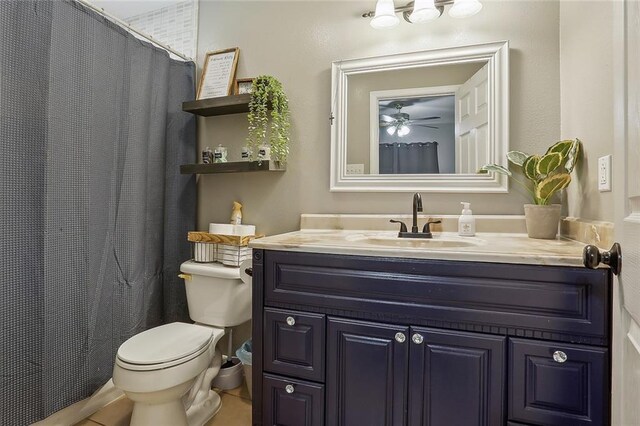 bathroom featuring toilet, ceiling fan, tile patterned flooring, and vanity