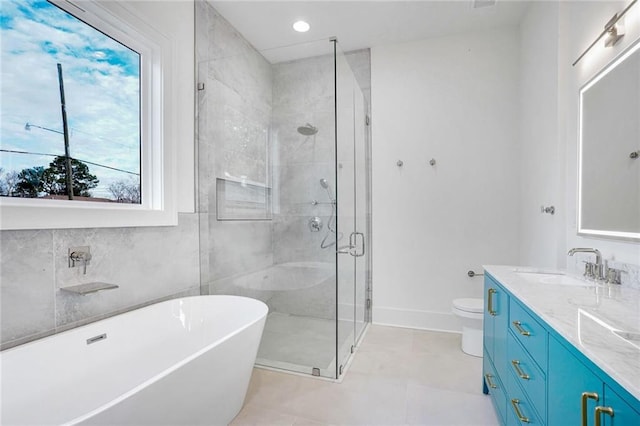 full bathroom with toilet, shower with separate bathtub, tile patterned floors, and vanity