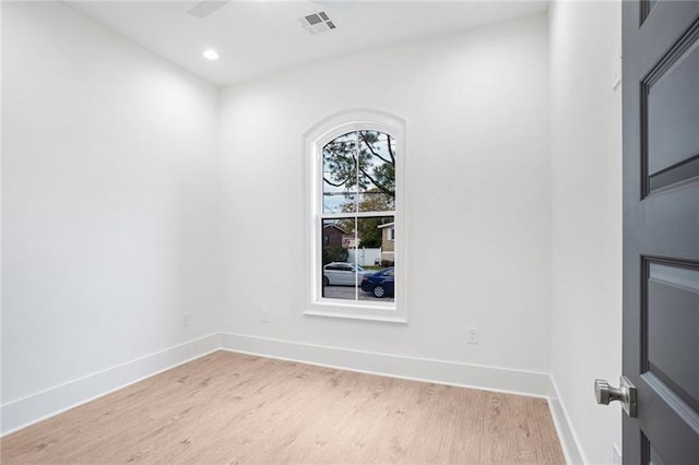 unfurnished room with light wood-type flooring