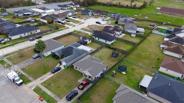 ranch-style home with a garage and a front lawn