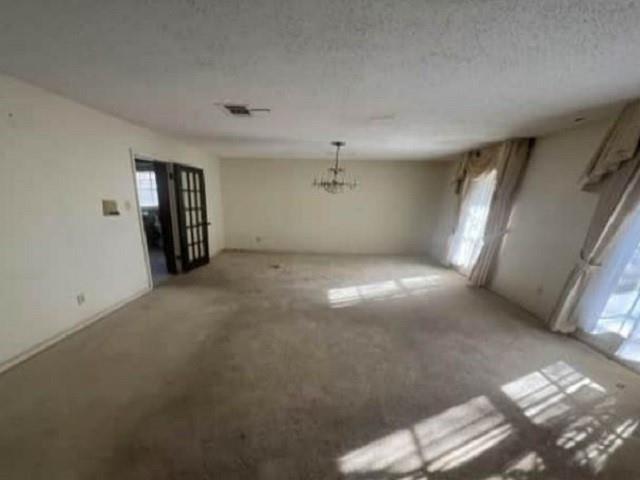 spare room featuring a textured ceiling