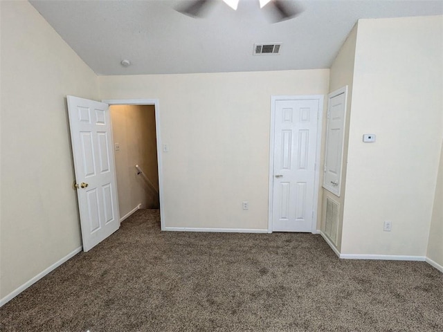 unfurnished bedroom featuring carpet flooring, baseboards, and visible vents