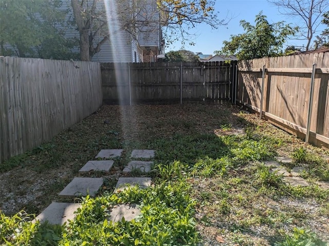 view of yard featuring a fenced backyard