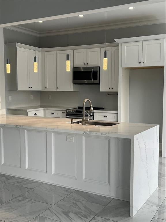 kitchen with marble finish floor, appliances with stainless steel finishes, a sink, and white cabinets