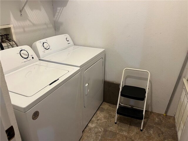 washroom with washer and dryer