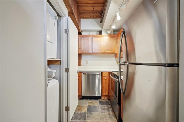 kitchen featuring wooden ceiling, appliances with stainless steel finishes, beamed ceiling, and washer / clothes dryer