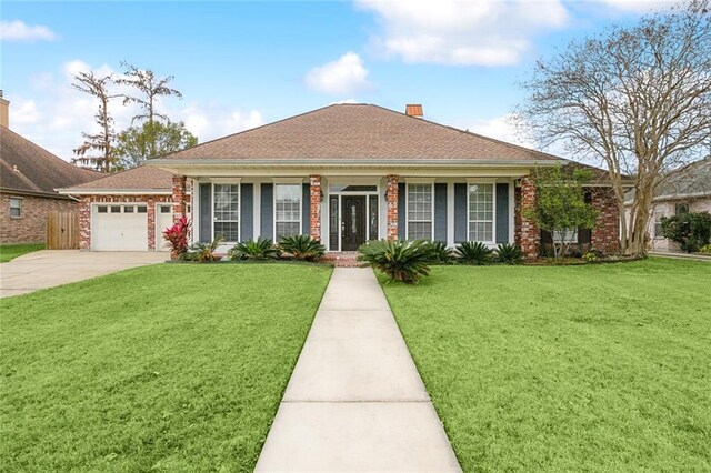 view of front facade with a front lawn and a garage