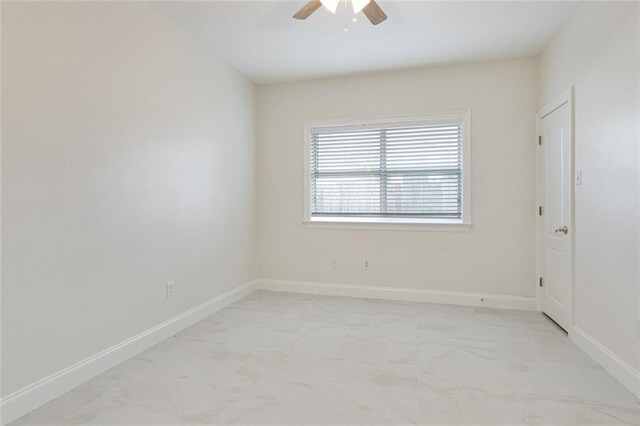 unfurnished room with ceiling fan