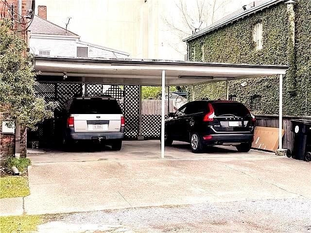 view of vehicle parking featuring a carport