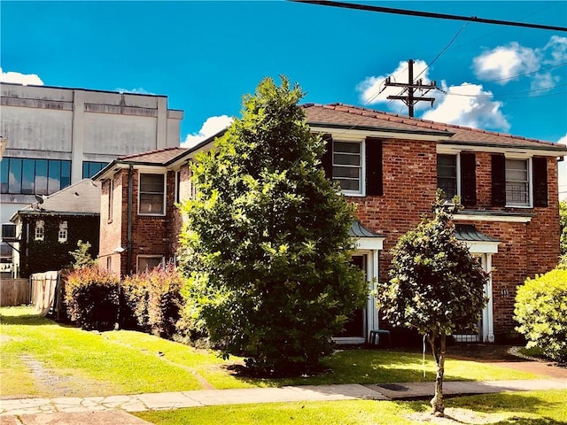 view of front of home with a front yard