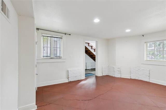 7917 Sycamore St, New Orleans, LA 70118 - unfurnished room featuring stairs, healthy amount of natural light, recessed lighting, and baseboards