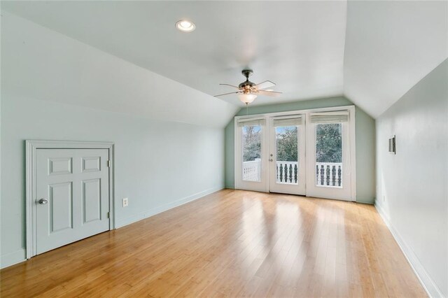 bonus room with lofted ceiling, french doors, ceiling fan, and light hardwood / wood-style floors