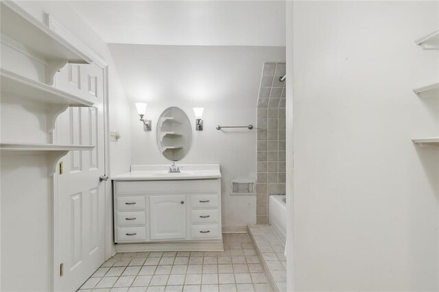 bathroom with vanity and shower / washtub combination