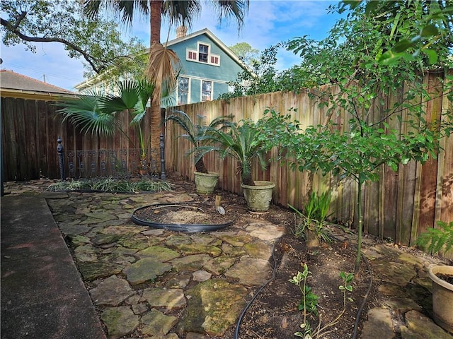 7917 Sycamore St, New Orleans, LA 70118 - fenced backyard featuring a patio
