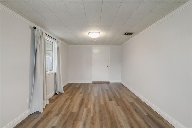 spare room with light hardwood / wood-style floors