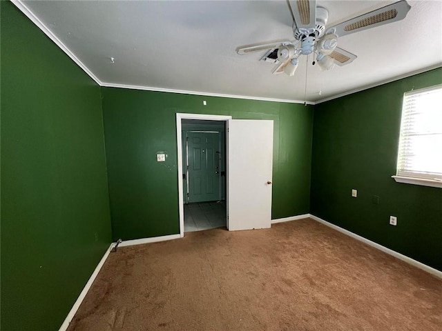 unfurnished bedroom featuring crown molding, carpet flooring, and ceiling fan