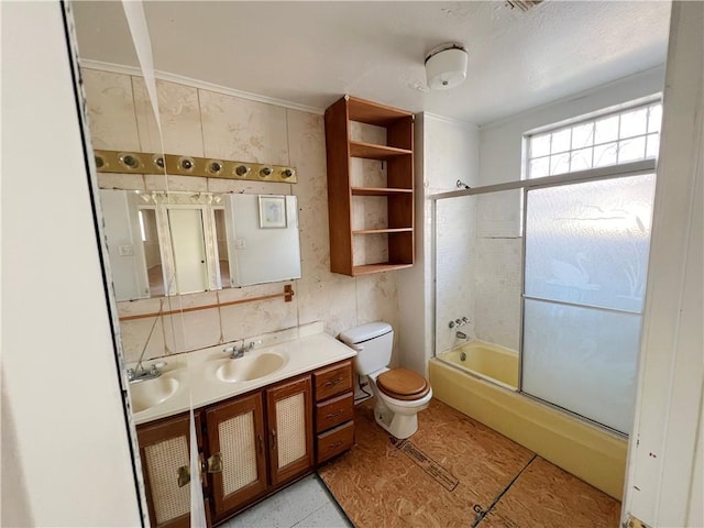 full bathroom with toilet, vanity, shower / bath combination with glass door, and tile patterned flooring