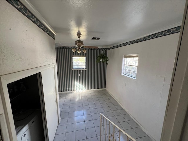 unfurnished dining area featuring plenty of natural light, ceiling fan, and light tile patterned flooring