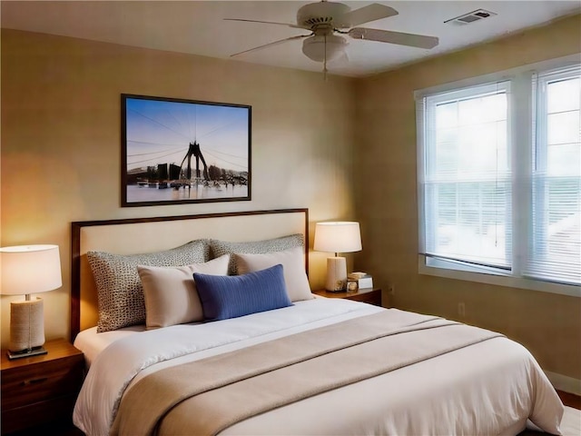 bedroom featuring ceiling fan and hardwood / wood-style flooring