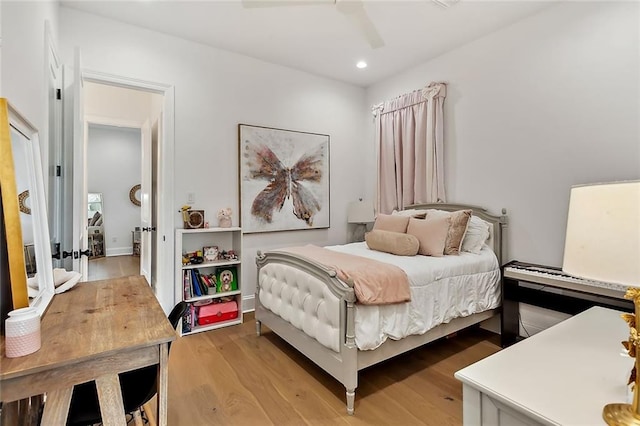 bedroom featuring recessed lighting, light wood-style flooring, and a ceiling fan