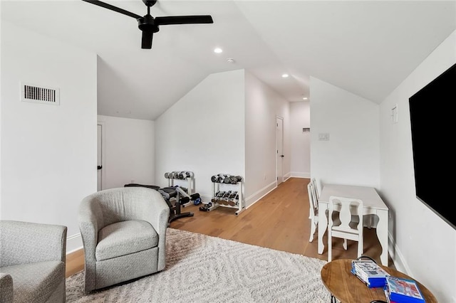 sitting room featuring visible vents, vaulted ceiling, recessed lighting, wood finished floors, and a ceiling fan