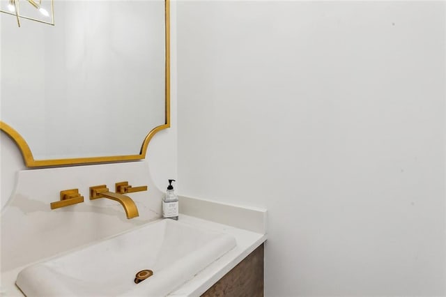 bathroom featuring vanity and a notable chandelier