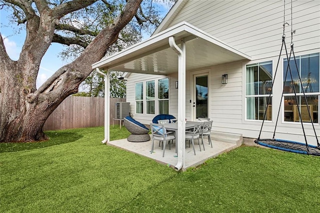 view of patio / terrace featuring fence and central AC