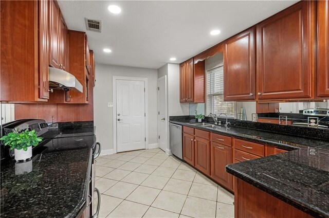 kitchen with electric stove, light tile patterned flooring, dishwasher, dark stone counters, and sink