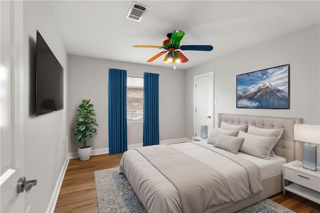 bedroom featuring ceiling fan and hardwood / wood-style floors