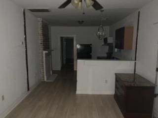 kitchen with hardwood / wood-style flooring and ceiling fan