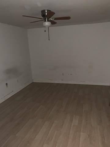 unfurnished room featuring ceiling fan and wood-type flooring