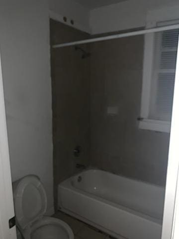 bathroom featuring toilet and shower / washtub combination