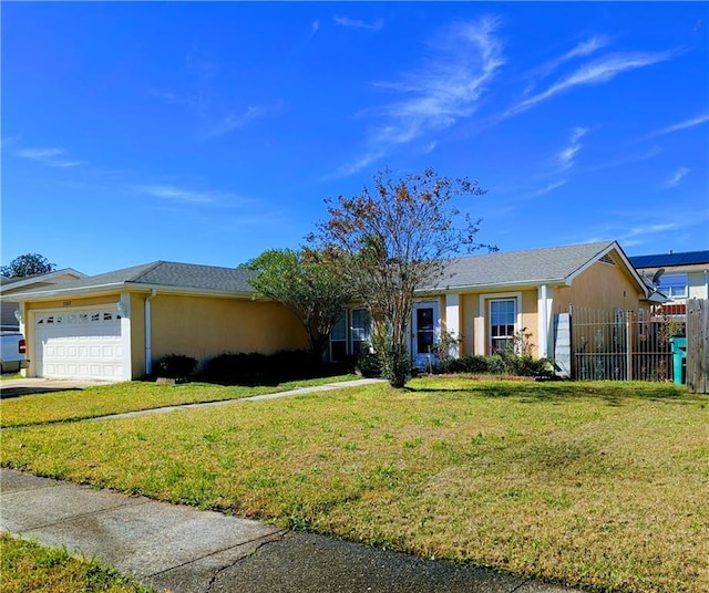 ranch-style home with a front yard and a garage