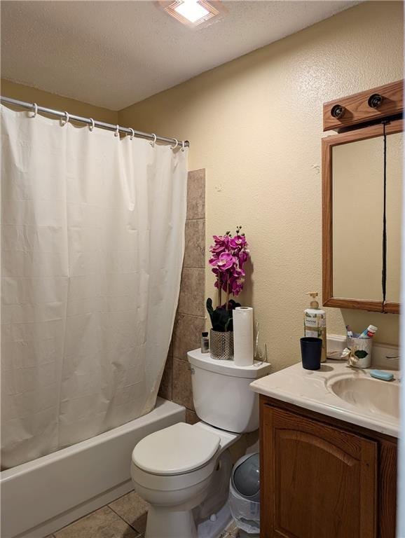 full bathroom with toilet, vanity, tile patterned flooring, a textured ceiling, and shower / bath combo with shower curtain