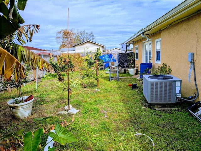 view of yard with central AC