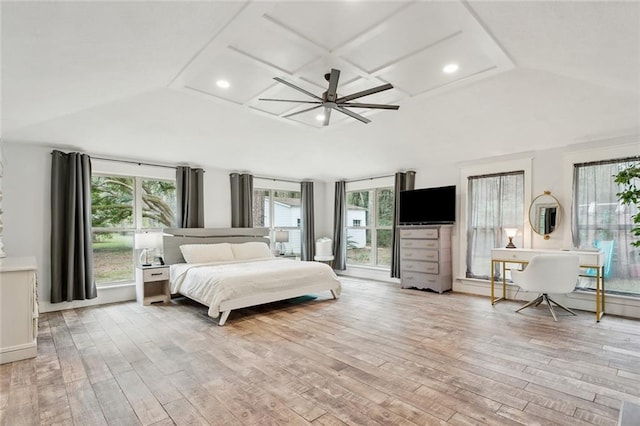 bedroom with ceiling fan, light wood-type flooring, and lofted ceiling